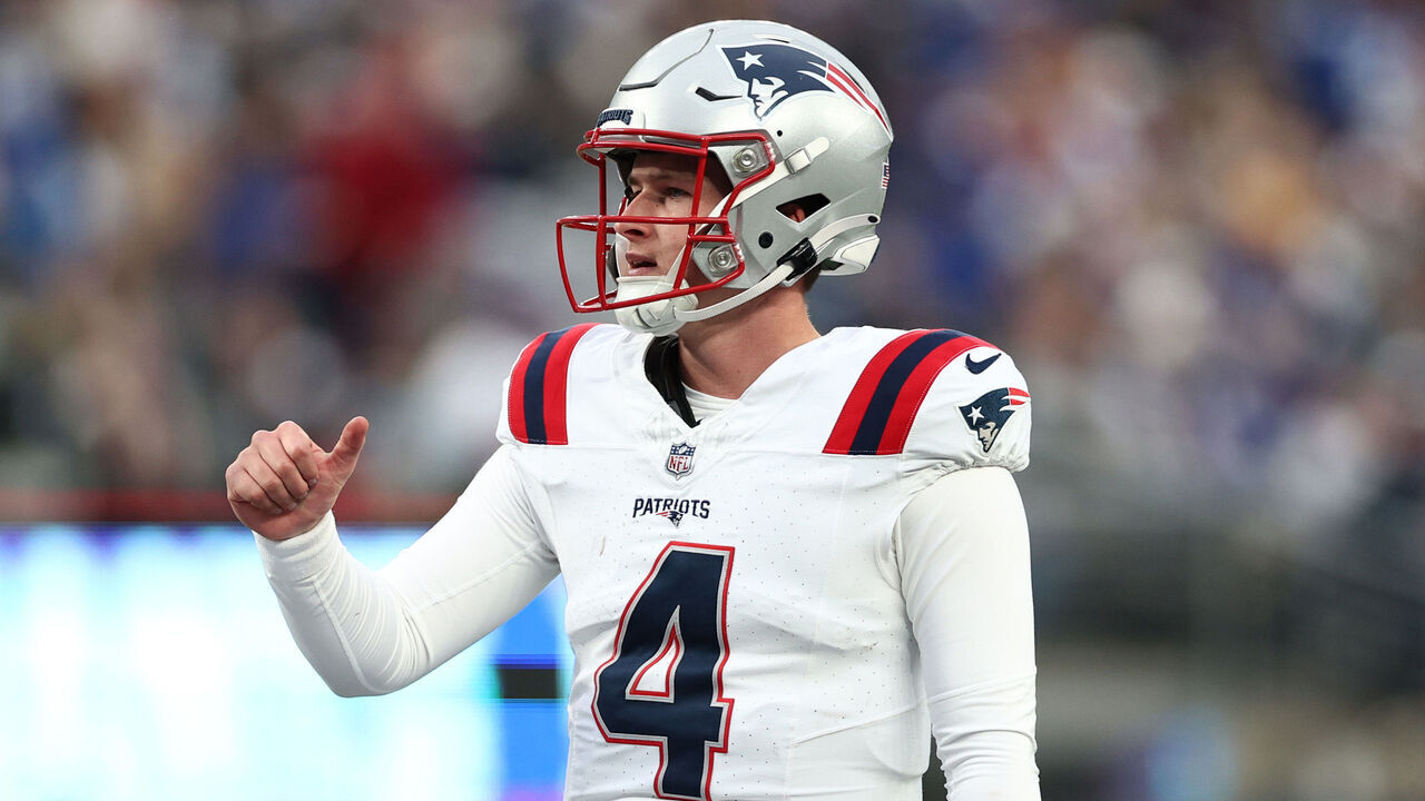 EAST RUTHERFORD, NEW JERSEY - NOVEMBER 26: Bailey Zappe #4 of the New England Patriots calls a play during the third quarter against the New York Giants at MetLife Stadium on November 26, 2023 in East Rutherford, New Jersey.
