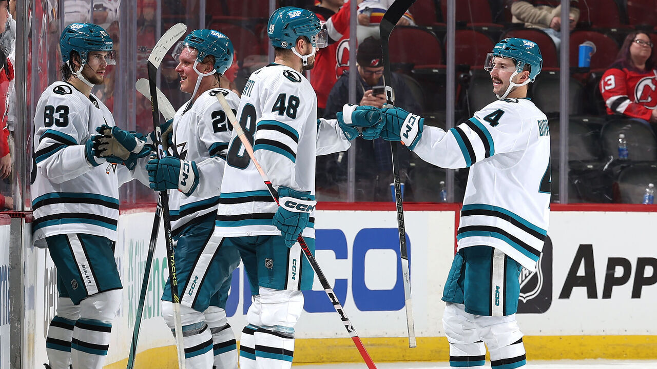 NEWARK, NEW JERSEY - DECEMBER 01: Nikita Okhotiuk #83,Fabian Zetterlund #20,Tomas Hertl #48 and Kyle Burroughs #4 of the San Jose Sharks celebrate the win over the New Jersey Devils at Prudential Center on December 01, 2023 in Newark, New Jersey. The San Jose Sharks defeated the New Jersey Devils 6-3.