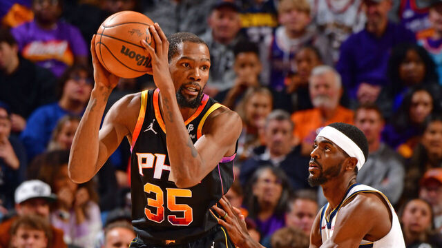 PHOENIX, AZ - DECEMBER 1: Kevin Durant #35 of the Phoenix Suns looks to pass the ball during the game against the Denver Nuggets on December 1, 2023 at Footprint Center in Phoenix, Arizona. Mandatory Copyright Notice: Copyright 2023 NBAE