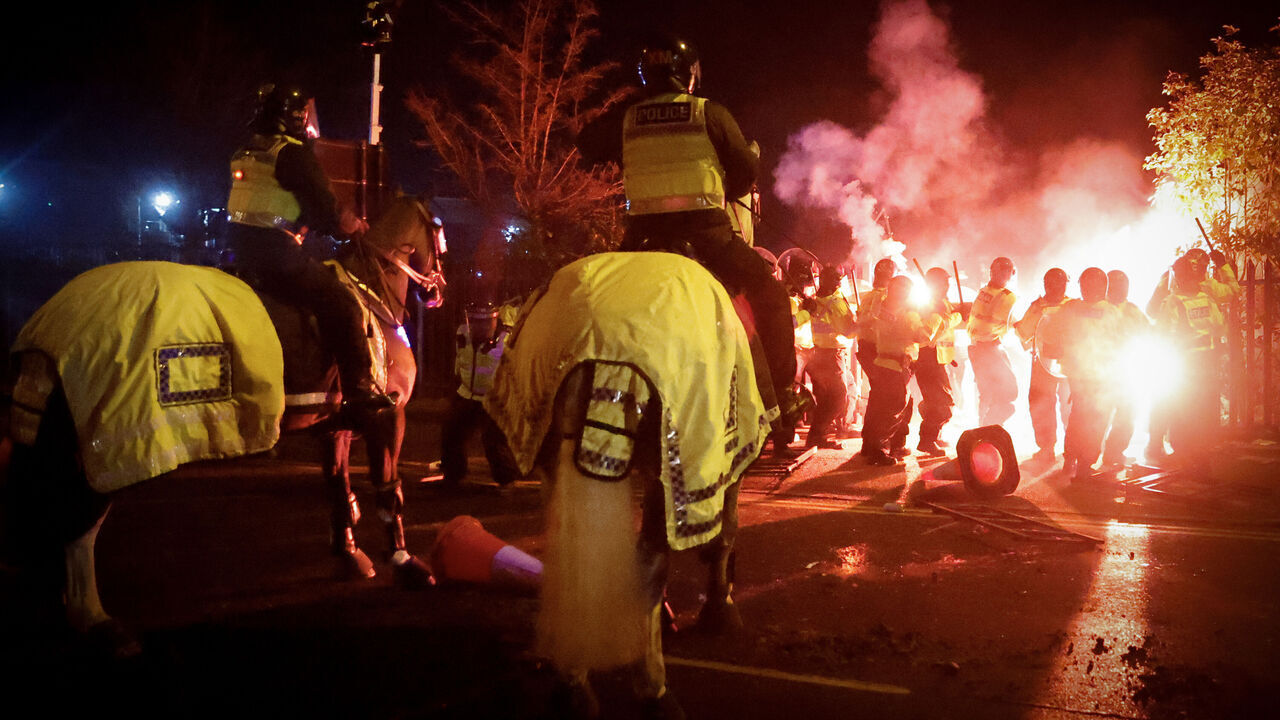 BIRMINGHAM, ENGLAND - NOVEMBER 30: Police clash with Legia Warszawa fans outside the stadium before the UEFA Europa Conference League match between Aston Villa and Legia Warszawa at Villa Park on November 30, 2023 in Birmingham, England.