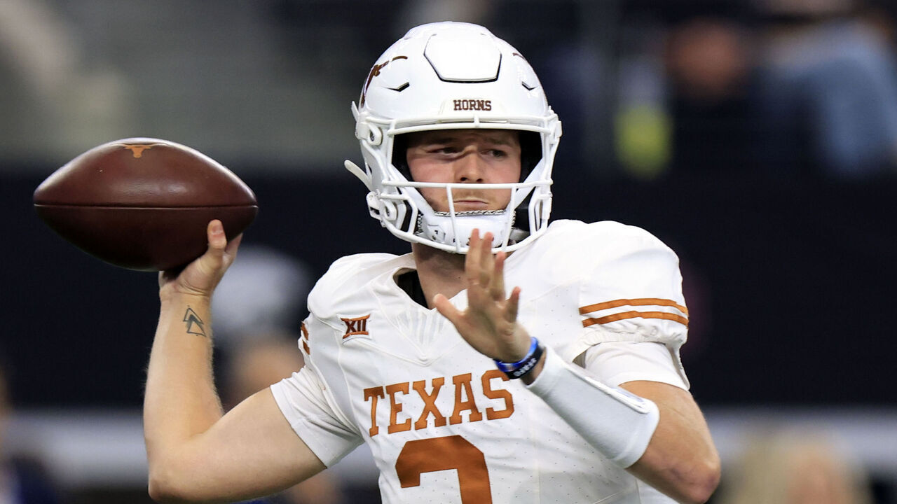 ARLINGTON, TX - DECEMBER 2: Quarterback Quinn Ewers #3 of the Texas Longhorns throws down field against the Oklahoma State Cowboys in the first half of the Big 12 Championship at AT&T Stadium on December 2, 2023 in Arlington, Texas.