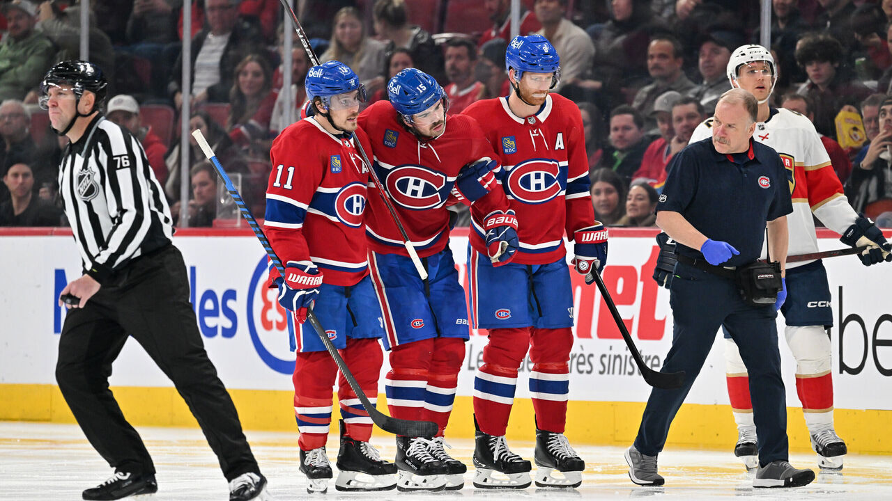 MONTREAL, CANADA - NOVEMBER 30: Brendan Gallagher #11 and Mike Matheson #8 help teammate Alex Newhook #15 of the Montreal Canadiens off the ice after getting hurt during the third period against the Florida Panthers at the Bell Centre on November 30, 2023 in Montreal, Quebec, Canada. The Florida Panthers defeated the Montreal Canadiens 5-1.