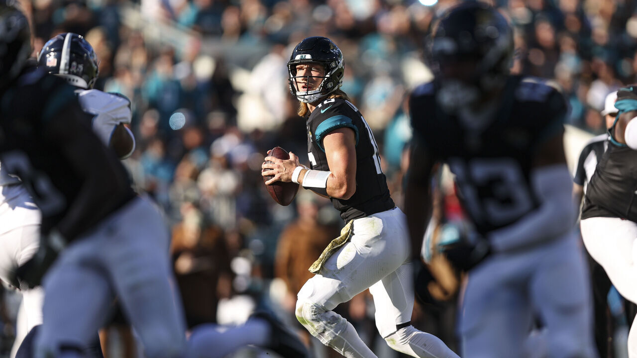 JACKSONVILLE, FL - NOVEMBER 19: Trevor Lawrence #16 of the Jacksonville Jaguars drops back to pass during an NFL football game against the Tennessee Titans at EverBank Stadium on November 19, 2023 in Jacksonville, Florida.