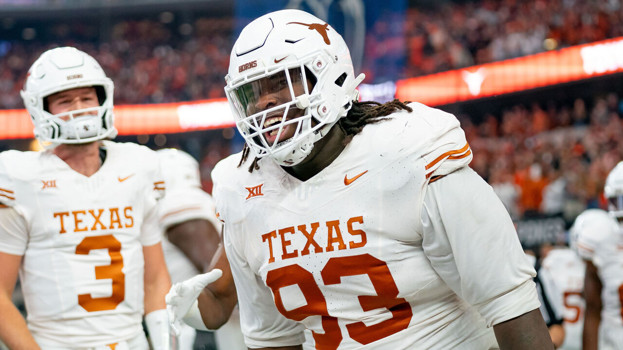 ARLINGTON, TX - DECEMBER 02: Texas Longhorns defensive lineman T'Vondre Sweat (93) smiles after catching a touchdown pass during the Big 12 Championship game between the Texas Longhorns and the Oklahoma State Cowboys on December 02, 2023 at AT&T Stadium in Arlington, TX.