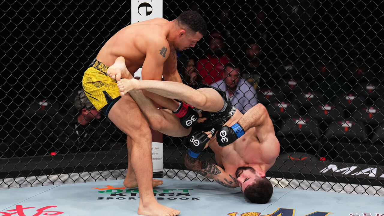 AUSTIN, TEXAS - DECEMBER 02: (L-R) Drakkar Klose slams Joe Solecki in a lightweight fight during the UFC Fight Night event at Moody Center on December 02, 2023 in Austin, Texas.