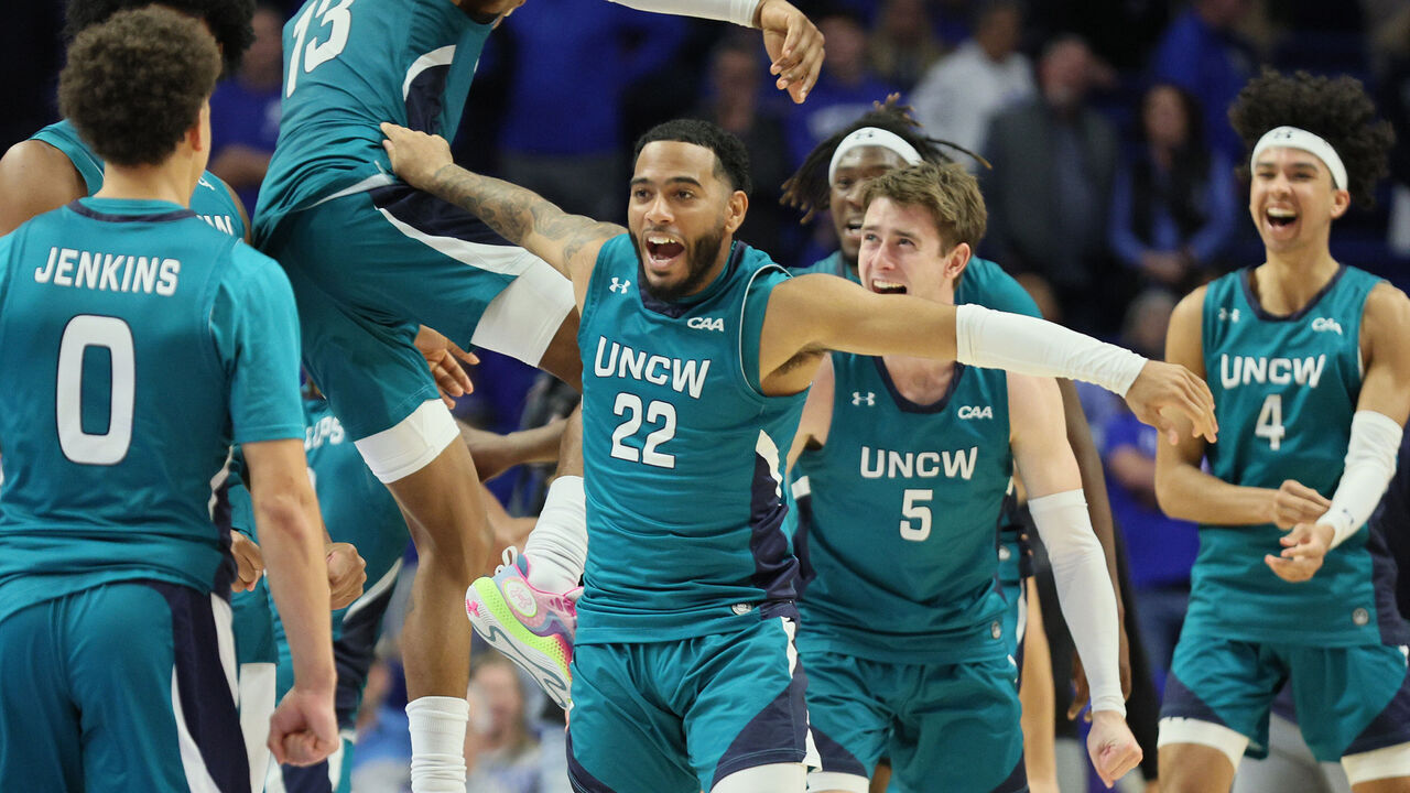 LEXINGTON, KENTUCKY - DECEMBER 02: Shemar Rathan-Mayes #22 of the UNC Wilmington Seahawks and his teammates celebrate after the 80-73 win over the Kentucky Wildcats at Rupp Arena on December 02, 2023 in Lexington, Kentucky.