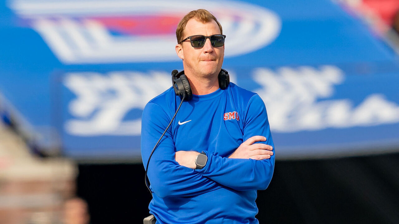 DALLAS, TX - NOVEMBER 25: Southern Methodist Mustangs head coach Rhett Lashlee watches a play during a college football game between the Navy Midshipmen and Southern Methodist Mustangs on November 25, 2023 at Gerald Ford Stadium in Dallas, TX.