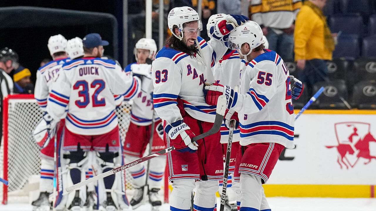 NASHVILLE, TENNESSEE - DECEMBER 2: Mika Zibanejad #93 congratulates Ryan Lindgren #55 of the New York Rangers on a 3-2 win against the Nashville Predators during an NHL game at Bridgestone Arena on December 2, 2023 in Nashville, Tennessee.