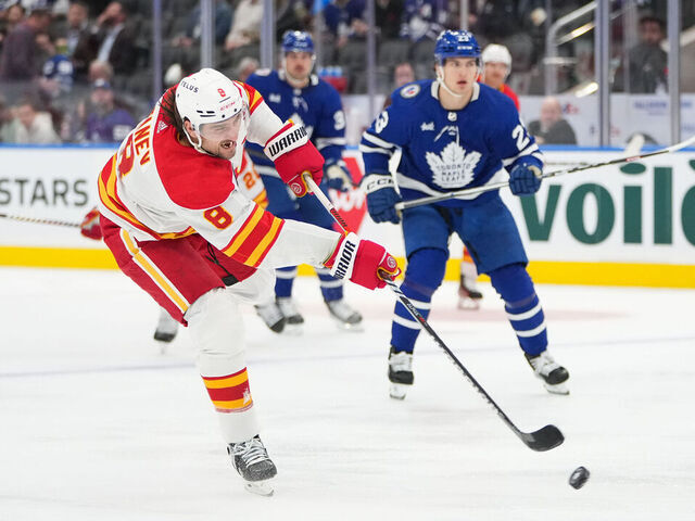 TORONTO, CANADA - NOVEMBER 10: Chris Tanev #8 of the Calgary Flames takes a shot against the Toronto Maple Leafs at Scotiabank Arena on November 10, 2023 in Toronto, Ontario, Canada.