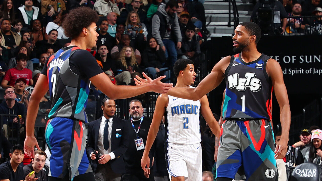 BROOKLYN, NY - DECEMBER 2: Cameron Johnson #2 and Mikal Bridges #1 of the Brooklyn Nets high five during the game against the Orlando Magic on December 2, 2023 at Barclays Center in Brooklyn, New York. Mandatory Copyright Notice: Copyright 2023 NBAE