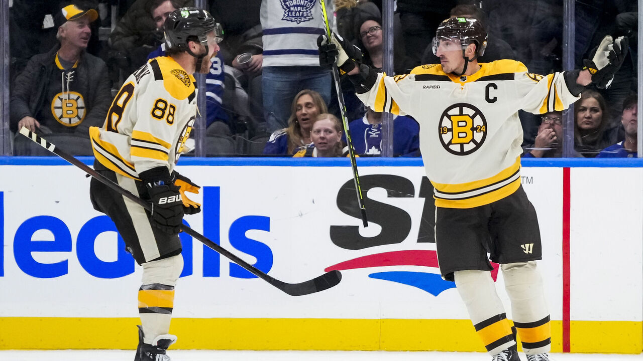 TORONTO, ON - DECEMBER 2: Brad Marchand #63 of the Boston Bruins celebrates after scoring the game winning goal in overtime against the Toronto Maple Leafs with teammate David Pastrnak #88 at the Scotiabank Arena on December 2, 2023 in Toronto, Ontario, Canada.