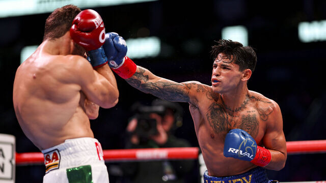 HOUSTON, TEXAS - DECEMBER 02: Ryan Garcia (R) lands a punch on Oscar Duarte (L) on December 02, 2023 at Toyota Center in Houston, Texas.