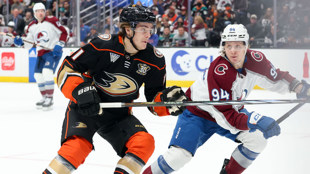 ANAHEIM, CA - DECEMBER 2: Leo Carlsson #91 of the Anaheim Ducks and Joel Kiviranta #94 of the Colorado Avalanche battle for position during the first period at Honda Center on December 2, 2023 in Anaheim, California.