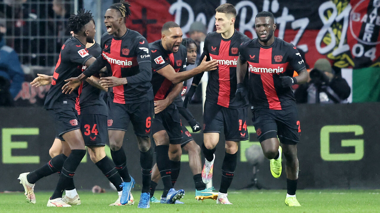 LEVERKUSEN, GERMANY - DECEMBER 03: Victor Boniface of Bayer Leverkusen celebrates with teammates after scoring the team's first goal during the Bundesliga match between Bayer 04 Leverkusen and Borussia Dortmund at BayArena on December 03, 2023 in Leverkusen, Germany.
