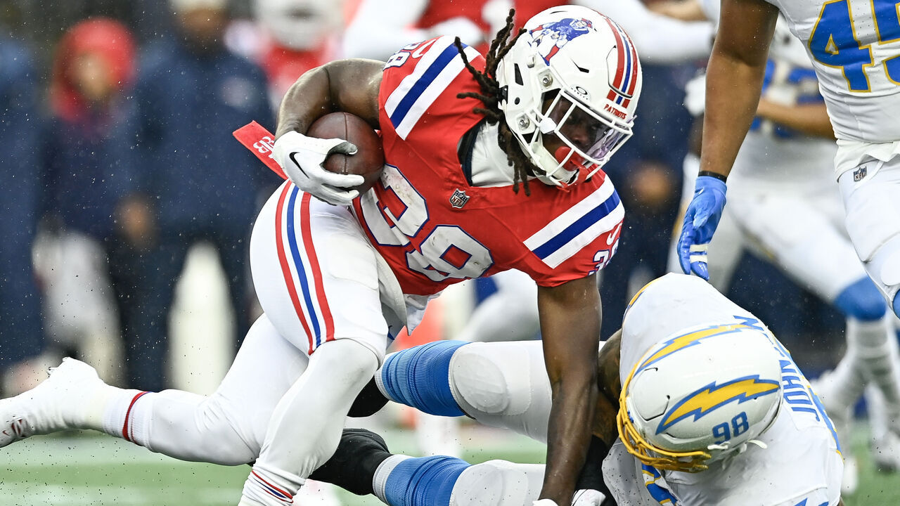 FOXBOROUGH, MASSACHUSETTS - DECEMBER 03: Rhamondre Stevenson #38 of the New England Patriots runs with the ball in the first quarter against the Los Angeles Chargers at Gillette Stadium on December 03, 2023 in Foxborough, Massachusetts.