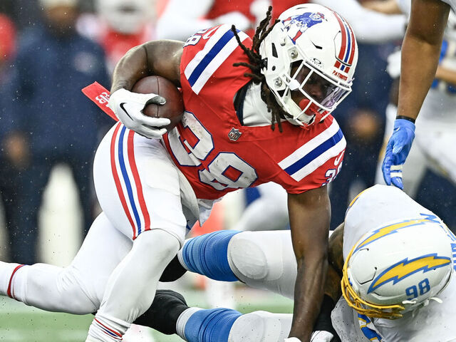 FOXBOROUGH, MASSACHUSETTS - DECEMBER 03: Rhamondre Stevenson #38 of the New England Patriots runs with the ball in the first quarter against the Los Angeles Chargers at Gillette Stadium on December 03, 2023 in Foxborough, Massachusetts.