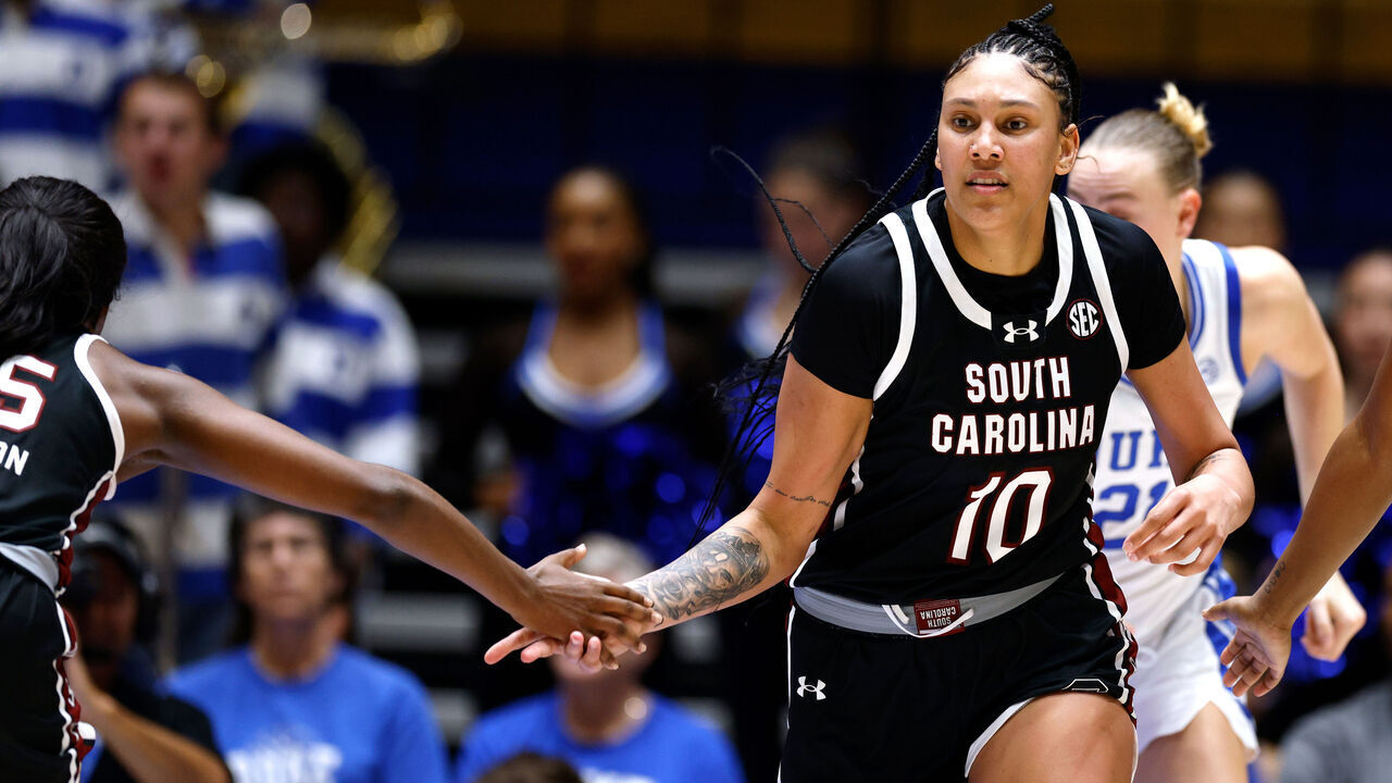 DURHAM, NORTH CAROLINA - DECEMBER 3: Kamilla Cardoso #10 of the South Carolina Gamecocks high-fives teammate Raven Johnson #25 following a basket during the second half of the game against the Duke Blue Devils at Cameron Indoor Stadium on December 3, 2023 in Durham, North Carolina. South Carolina won 77-61.