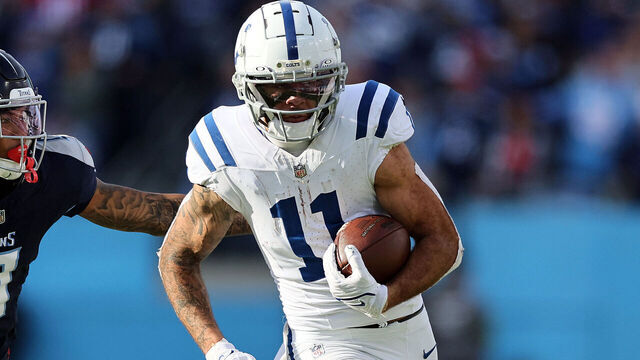 NASHVILLE, TENNESSEE - DECEMBER 03: Michael Pittman Jr. #11 of the Indianapolis Colts carries the ball past Sean Murphy-Bunting #0 of the Tennessee Titans during the second half at Nissan Stadium on December 03, 2023 in Nashville, Tennessee.