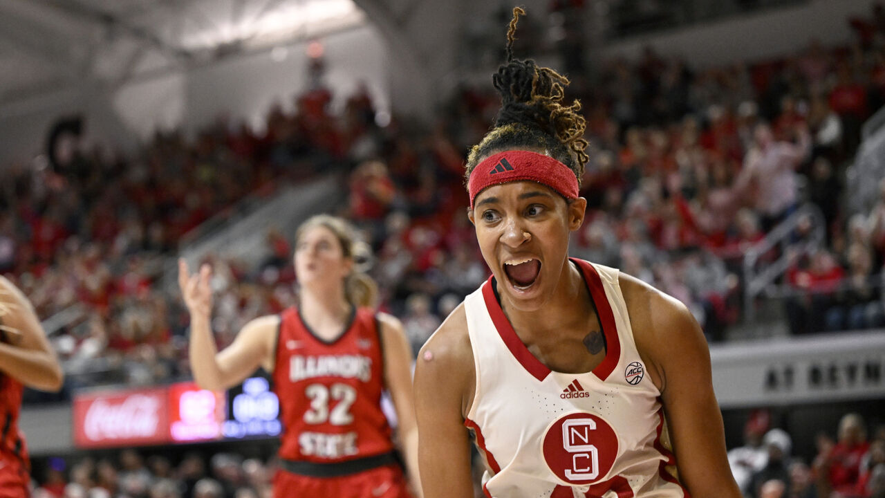 RALEIGH, NORTH CAROLINA - DECEMBER 03: Aziaha James #10 of the NC State Wolfpack celebrates her basket against the Illinois State Redbirds in the third quarter at Reynolds Coliseum on December 03, 2023 in Raleigh, North Carolina.