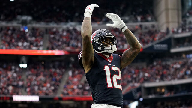 HOUSTON, TEXAS - DECEMBER 03: Nico Collins #12 of the Houston Texans celebrates after scoring a touchdown in the fourth quarter against the Denver Broncos at NRG Stadium on December 03, 2023 in Houston, Texas.