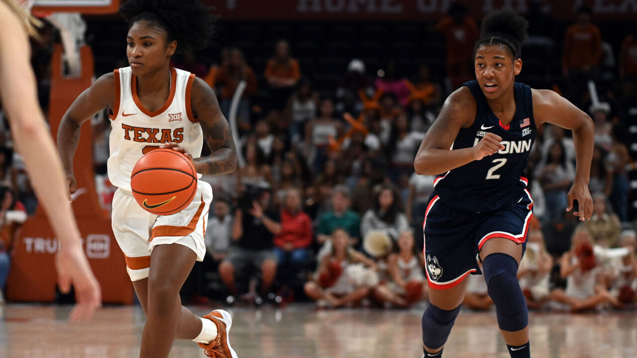 AUSTIN, TX - DECEMBER 03: Texas Longhorns forward Rori Harmon (3) is chased by University of Connecticut Huskies guard K. K. Arnold (2) during game featuring the Connecticut Huskies and Texas Longhorns on December 3, 2023, at the Moody Center in Austin, TX.