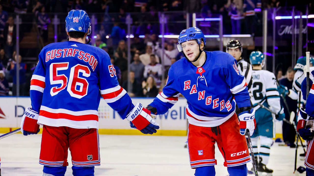 NEW YORK, NY - DECEMBER 03: Hats begin raining down from the stands onto the ice after New York Rangers Left Wing Artemi Panarin (10) completes a Hat Trick, scoring his 3rd goal of the night during the third period of the National Hockey League game between the San Jose Sharks and the New York Rangers on December 3, 2023 at Madison Square Garden in New York, NY.
