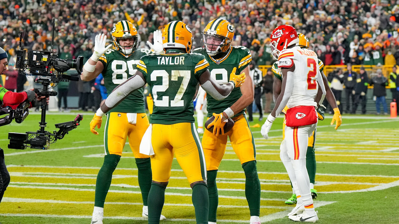 GREEN BAY, WI - DECEMBER 3: Wide receiver Christian Watson #9, tight end Tucker Kraft #85 and running back Patrick Taylor #27 of the Green Bay Packers celebrate a touch down during an NFL football game against the Kansas City Chiefs at Lambeau Field on December 3, 2023 in Green Bay, Wisconsin.