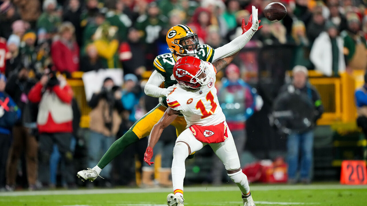 GREEN BAY, WI - DECEMBER 3: Cornerback Carrington Valentine #37 of the Green Bay Packers deflects a pass intended for wide receiver Marquez Valdes-Scantling #11 of the Kansas City Chiefs during an NFL football game against the Kansas City Chiefs at Lambeau Field on December 3, 2023 in Green Bay, Wisconsin.
