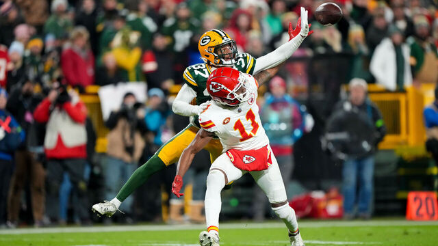 GREEN BAY, WI - DECEMBER 3: Cornerback Carrington Valentine #37 of the Green Bay Packers deflects a pass intended for wide receiver Marquez Valdes-Scantling #11 of the Kansas City Chiefs during an NFL football game against the Kansas City Chiefs at Lambeau Field on December 3, 2023 in Green Bay, Wisconsin.