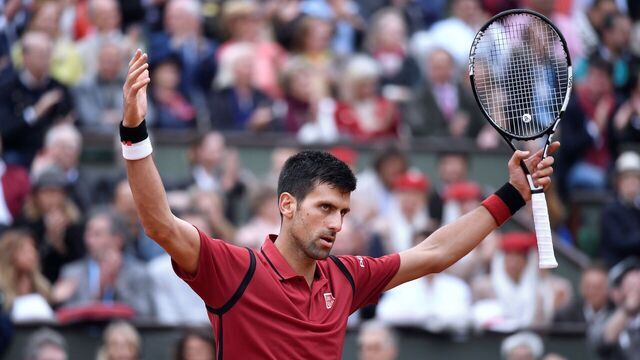 Serbia's Novak Djokovic celebrates after winning a point during the men's final match against Britain's Andy Murray at the Roland Garros 2016 French Tennis Open in Paris on June 5, 2016. / AFP / PHILIPPE LOPEZ