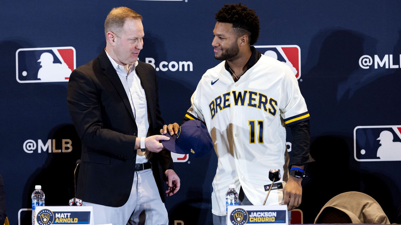 NASHVILE, TN - DECEMBER 04: Milwaukee Brewers General Manager Matt Arnold congratulates Jackson Chourio #11 on the long term contract during the Jackson Chourio Press Conference at the Gaylord Opryland Resort & Convention Center on Monday, December 4, 2023 in Nashvile, Tennessee.