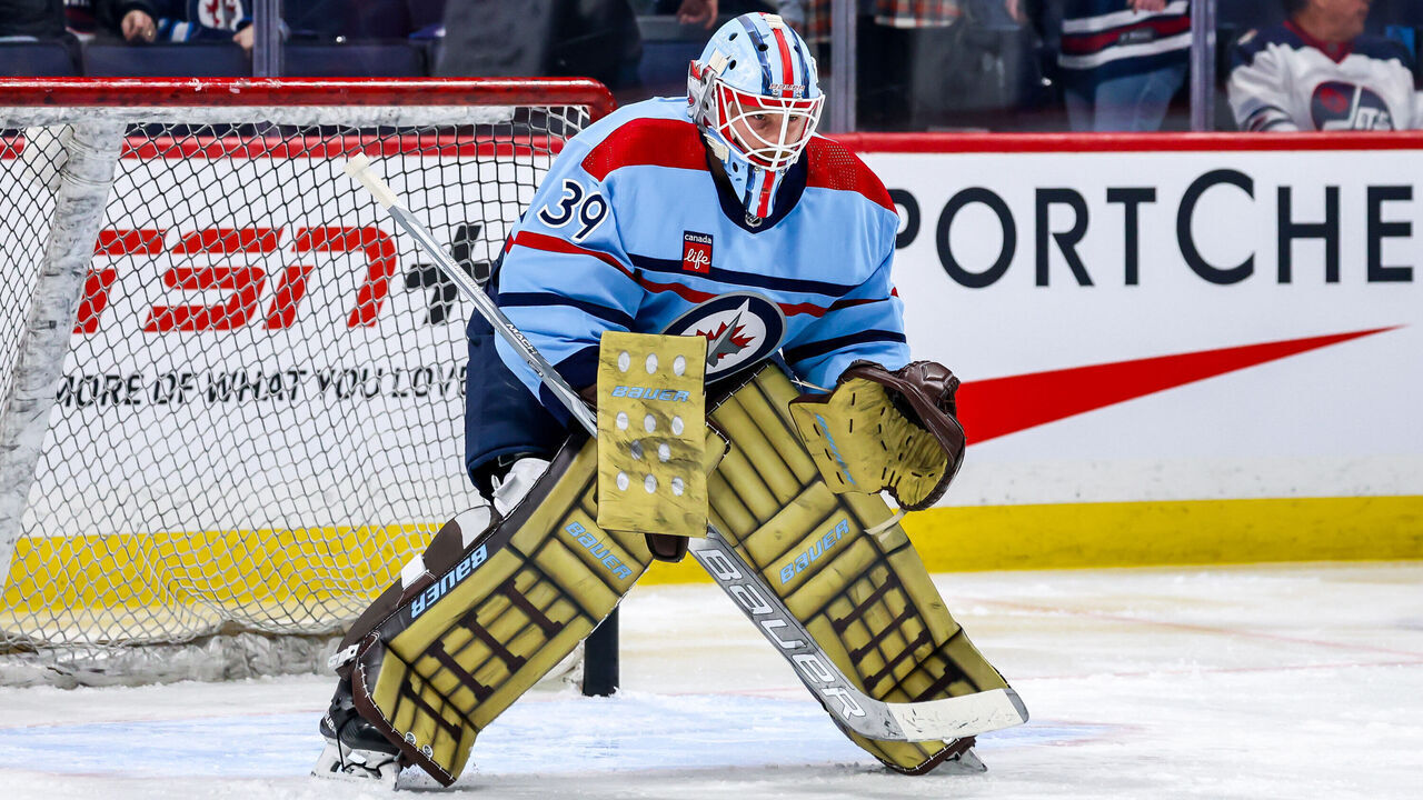 WINNIPEG, CANADA - DECEMBER 4: Goaltender Laurent Brossoit #39 of the Winnipeg Jets takes part in the pre-game warm up prior to NHL action against the Carolina Hurricanes on Canadian Armed Forces Appreciation Night at the Canada Life Centre on December 4, 2023 in Winnipeg, Manitoba, Canada.