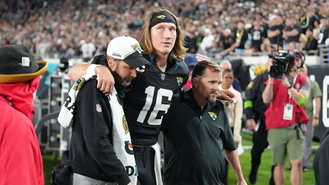JACKSONVILLE, FL - DECEMBER 04: Jacksonville Jaguars quarterback Trevor Lawrence (16) is helped off of the field after being injured during the game between the Cincinnati Bengals and the Jacksonville Jaguars on Monday, December 4, 2023, EverBank Stadium, Jacksonville, Fla.
