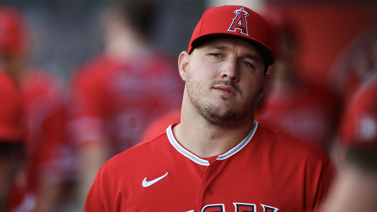 ANAHEIM, CALIFORNIA - AUGUST 22: Mike Trout #27 of the Los Angeles Angels looks on from the dugout ahead of the game against the Cincinnati Reds at Angel Stadium of Anaheim on August 22, 2023 in Anaheim, California.