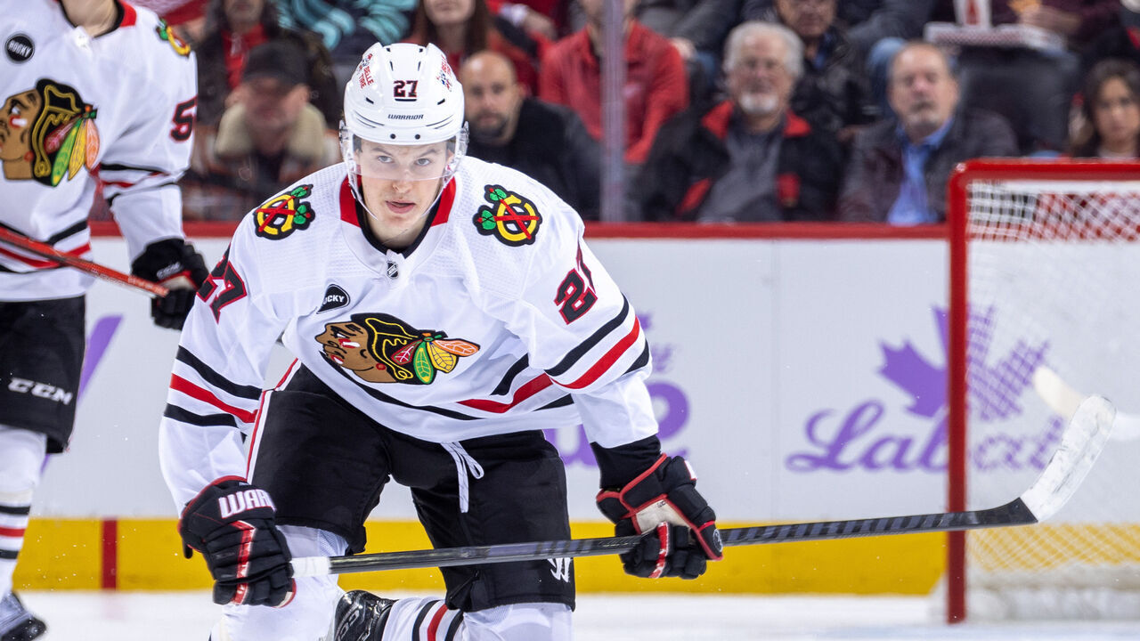 DETROIT, MI - NOVEMBER 30: Lukas Reichel #27 of the Chicago Blackhawks skates up ice against the Detroit Red Wings during the second period at Little Caesars Arena on November 30, 2023 in Detroit, Michigan. Detroit defeated Chicago 5-1.