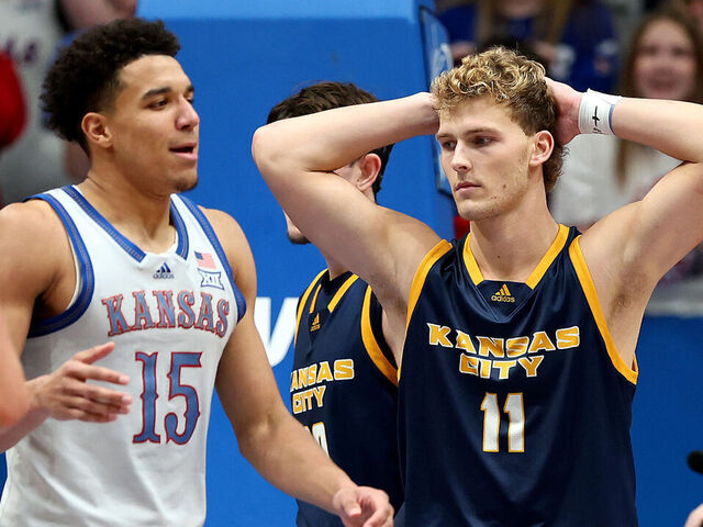LAWRENCE, KANSAS - DECEMBER 05: Anderson Kopp #11 of the UMKC Kangaroos reacts after a foul on Kevin McCullar Jr. #15 of the Kansas Jayhawks during the 2nd half of the game at Allen Fieldhouse on December 05, 2023 in Lawrence, Kansas.