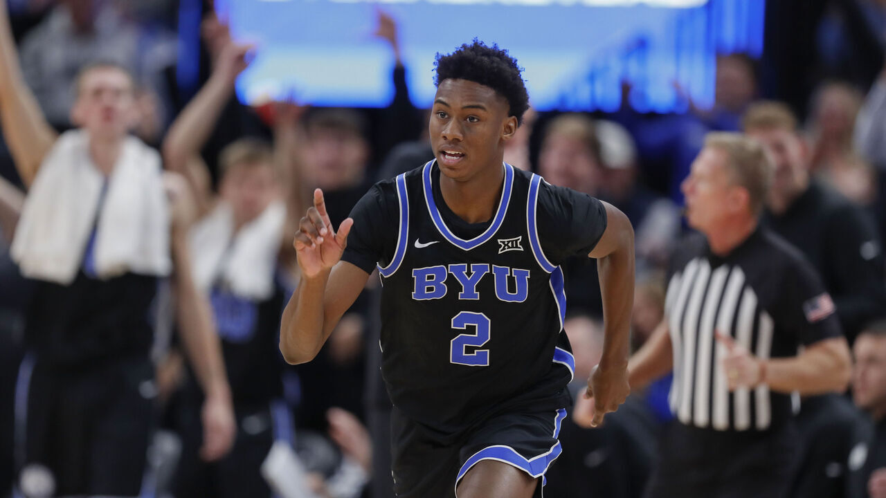 SALT LAKE CITY, UT - DECEMBER 1: Jaxon Robinson #2 of the Brigham Young Cougars reacts after sinking a three-pointer against the Fresno State Bulldogs during the second half of their game at the Delta Center on December 1, 2023 in Salt Lake City, Utah.