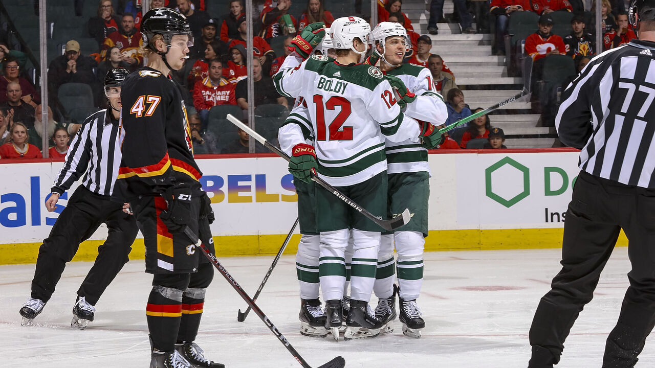 CALGARY, AB - DECEMBER 5: Matthew Boldy #12 of the Minnesota Wild celebrates with teammates after a goal against the Calgary Flames at Scotiabank Saddledome on December 5, 2023 in Calgary, Alberta, Canada.