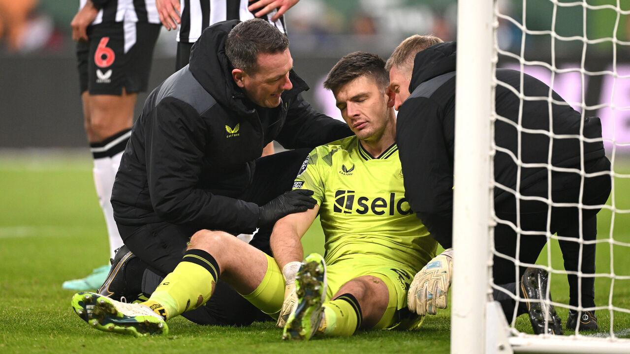 NEWCASTLE UPON TYNE, ENGLAND - DECEMBER 02: Newcastle United goalkeeper Nick Pope receives treatment for a shoulder injury which forces him to leave the field during the Premier League match between Newcastle United and Manchester United at St. James Park on December 02, 2023 in Newcastle upon Tyne, England.