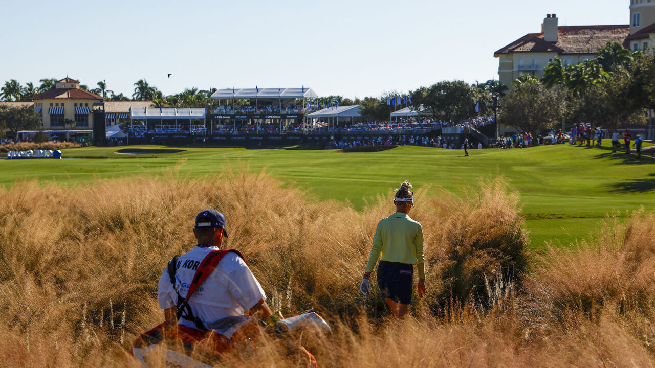 NAPLES, FLORIDA - NOVEMBER 19: Nelly Korda of the United States and caddie Jason McDede walk up the 18th fairway during the final round of the CME Group Tour Championship at Tiburon Golf Club on November 19, 2023 in Naples, Florida.