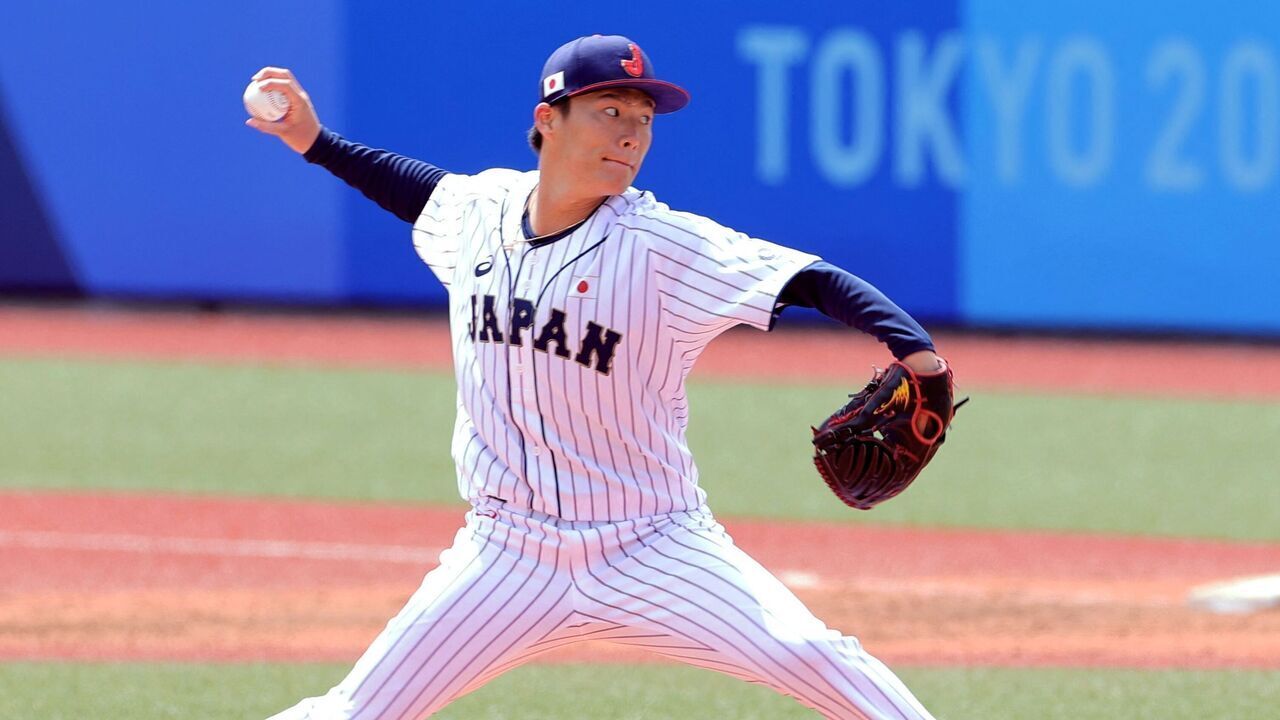 Japan's starting pitcher Yoshinobu Yamamoto hurls the ball during the fourth inning of the Tokyo 2020 Olympic Games baseball opening round group A game between Dominican Republic and Japan at Fukushima Azuma Baseball Stadium in Fukushima, Japan, on July 28, 2021.