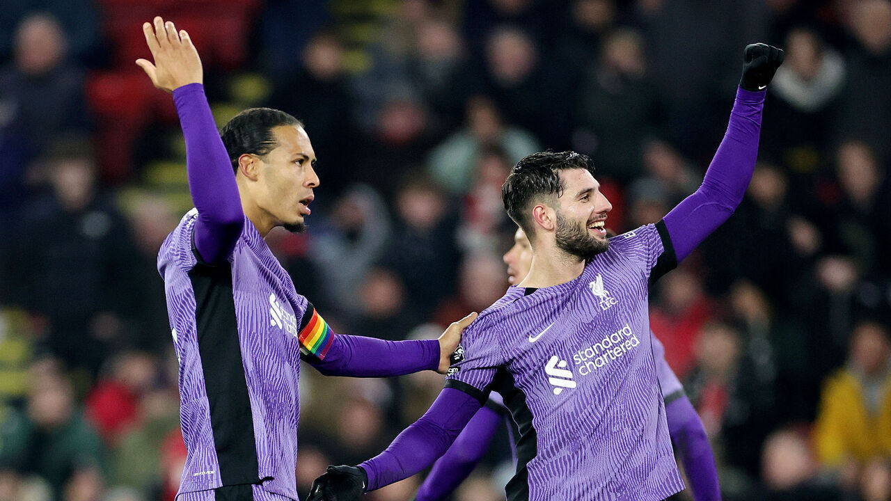 SHEFFIELD, ENGLAND - DECEMBER 06: Dominik Szoboszlai of Liverpool celebrates with Virgil van Dijk of Liverpool after scoring his team's second goal during the Premier League match between Sheffield United and Liverpool FC at Bramall Lane on December 06, 2023 in Sheffield, England.