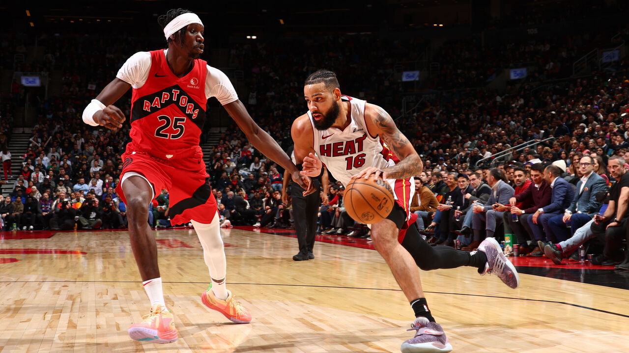 TORONTO, CANADA - DECEMBER 6: Caleb Martin #16 of the Miami Heat drives to the basket during the game against the Toronto Raptors on December 6, 2023 at the Scotiabank Arena in Toronto, Ontario, Canada. Mandatory Copyright Notice: Copyright 2023 NBAE