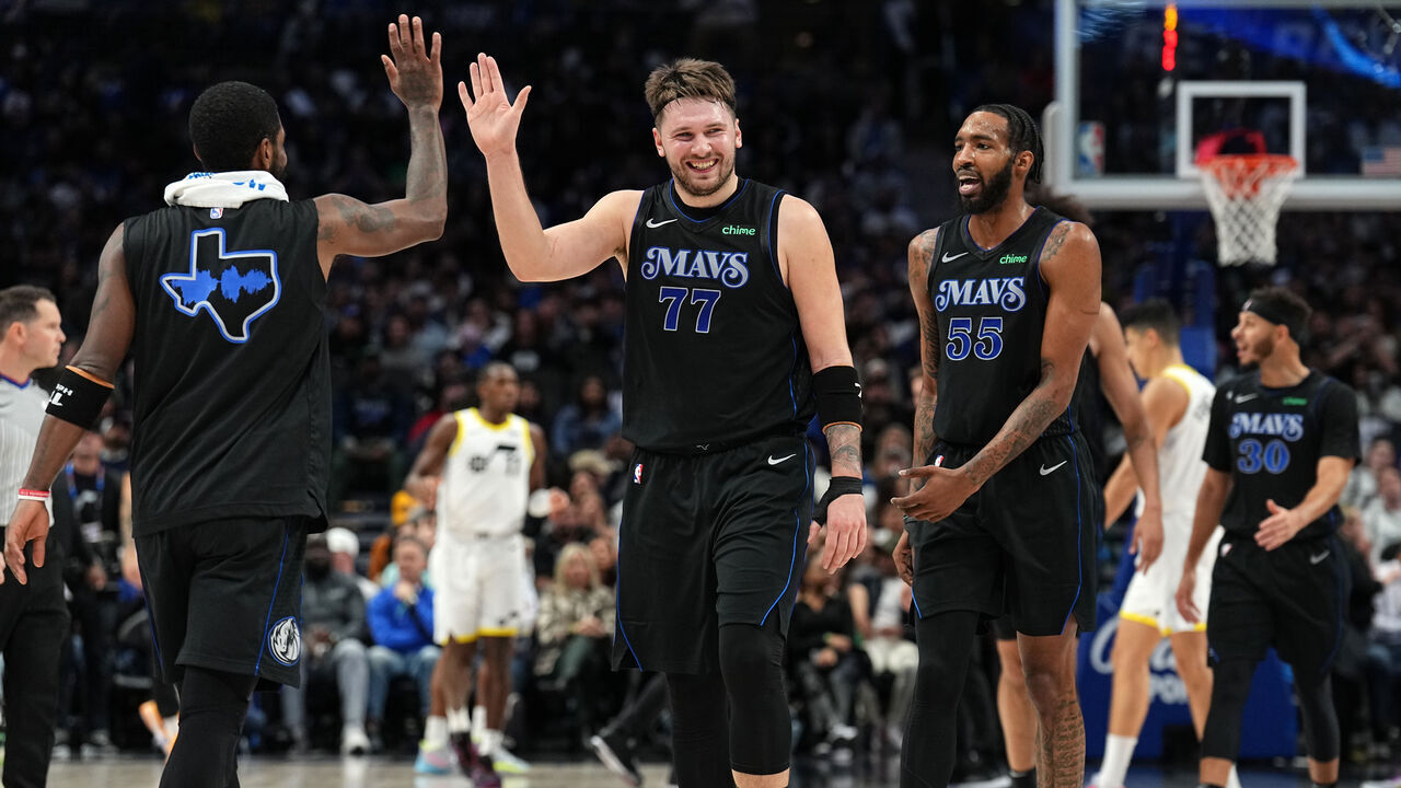 DALLAS, TX - DECEMBER 6 : Luka Doncic #77 and Derrick Jones Jr. #55 of the Dallas Mavericks smile during the game against the Utah Jazz on December 6, 2023 at the American Airlines Center in Dallas, Texas. Mandatory Copyright Notice: Copyright 2023 NBAE