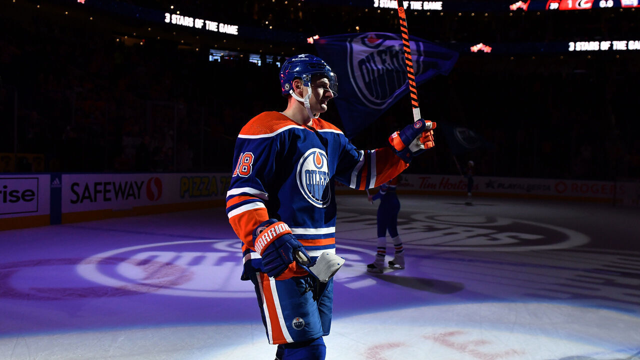 EDMONTON, CANADA - DECEMBER 06: Zach Hyman #18 of the Edmonton Oilers salutes the fans after his team's victory over the Carolina Hurricanes at Rogers Place on December 6, 2023, in Edmonton, Alberta, Canada.