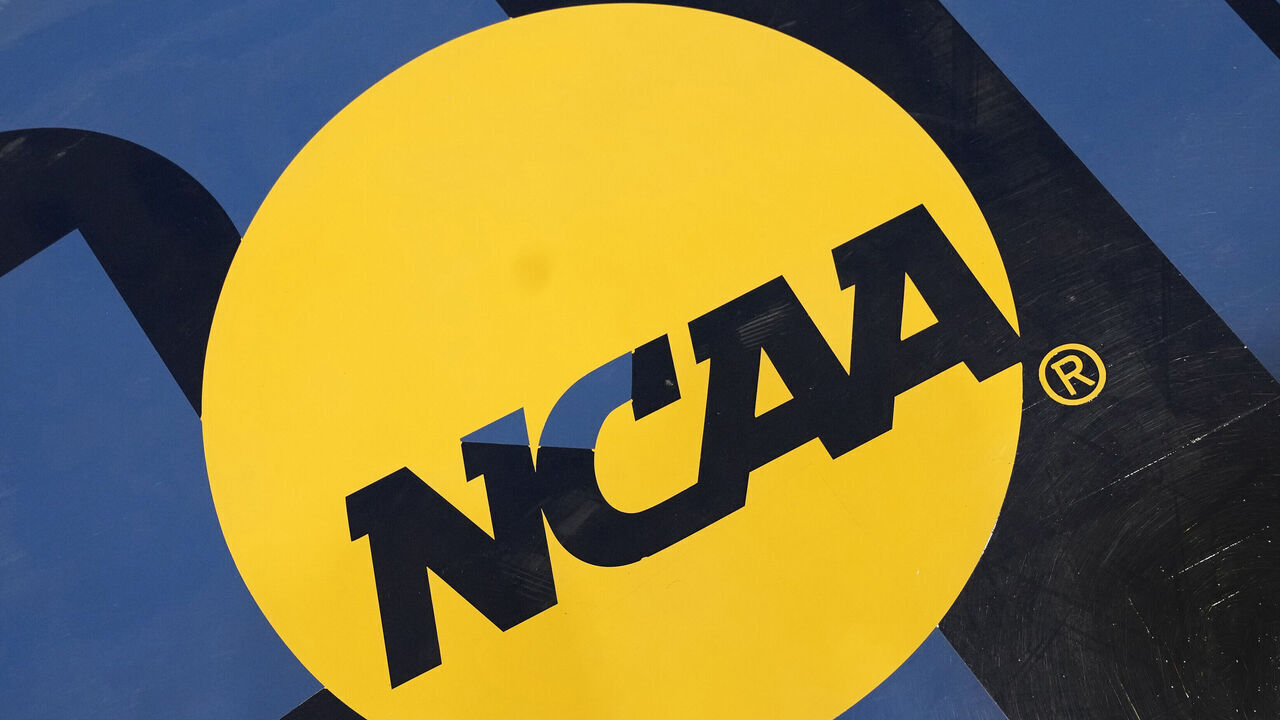 WASHINGTON, DC - NOVEMBER 18: The NCAA logo on the floor during a college basketball game between the New Hampshire Wildcats and the George Washington Revolutionaries at the Smith Center on November 18, 2023 in Washington, DC.