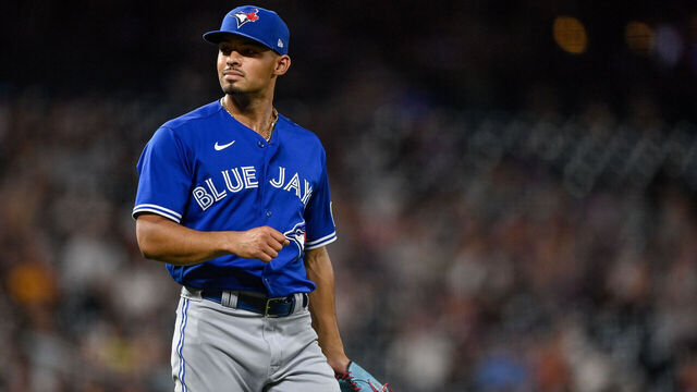 DENVER, CO - SEPTEMBER 1: Jordan Hicks #12 of the Toronto Blue Jays reacts as he pitches against the Colorado Rockies in the seventh inning at Coors Field on September 1, 2023 in Denver, Colorado.