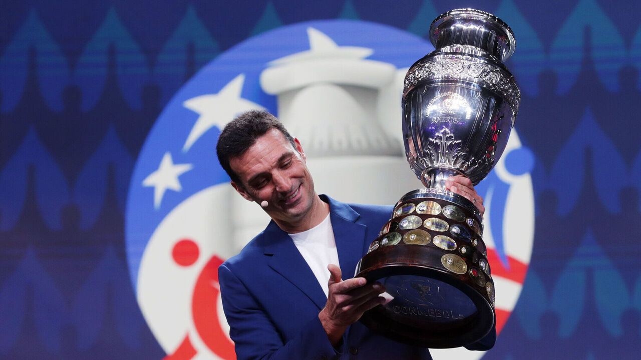 MIAMI, FLORIDA - DECEMBER 07: Lionel Scaloni, Head Coach of Argentina, presents the Copa America trophy during the official draw of CONMEBOL Copa America 2024 at James L. Knight Center on December 07, 2023 in Miami, Florida.