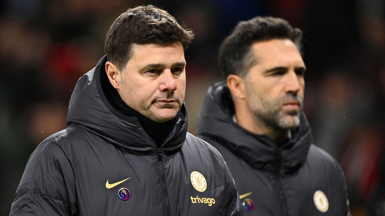 Chelsea's Argentinian head coach Mauricio Pochettino (L) reacts after the English Premier League football match between Manchester United and Chelsea at Old Trafford in Manchester, north west England, on December 6, 2023. Manchester United won the match 2-1.