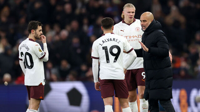 BIRMINGHAM, ENGLAND - DECEMBER 06: Pep Guardiola, Manager of Manchester City, speaks with Julian Alvarez of Manchester City during the Premier League match between Aston Villa and Manchester City at Villa Park on December 06, 2023 in Birmingham, England.